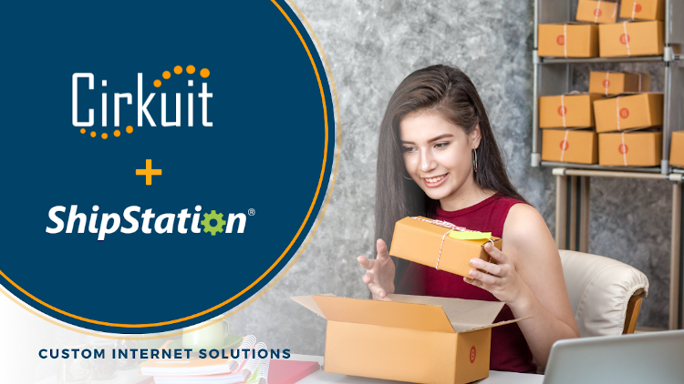 image of a woman sitting at a desk preparing shipping box for her ecommerce business. text: Cirkuit plus ShipStation. Custom Online Solutions